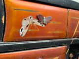 a close up of a piece of luggage with a butterfly on it