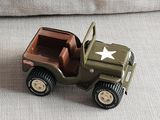 a toy army jeep with a star on the back