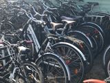 a lot of bikes that are parked in the dirt
