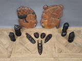 several pieces of carved wood sit on the floor next to each other