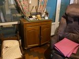 a chair that is next to a bed in a room