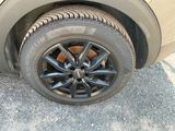 a close up of a tire on a car ' s rim