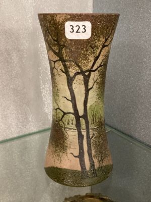 a vase that has a picture of a tree on it