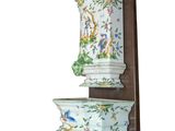 a picture of a wall mounted shelf with a vase on it