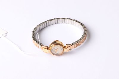 an image of a wrist watch with a chain around it