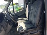 an image of the inside of a van with the driver ' s seat up