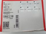 a red box with a label on it that has a barcode on it