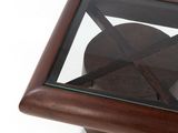 a glass table with a wooden base and a glass top
