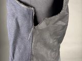 a close up of a mannequin torso with a pocket in the back