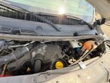 a car that has its hood open with the engine in it