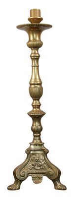 a candle that is sitting on a stand on a white background