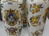two vases that are sitting on a table