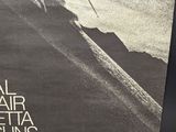 a black and white photo of a man skiing down a mountain