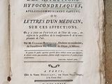 an old book that is open on a table