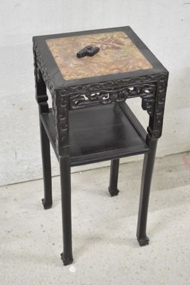 a small table with a drawer on top of it