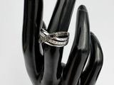 a black hand with a ring on it and a ring on it ' s finger