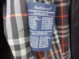 burbery ' s men ' s jacket and tie on display in a store