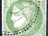un timbre vert sur lequel figure le visage d'une femme