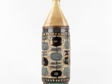 a vase that has a brown and black design on it
