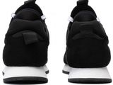a close up of a pair of black and white sneakers