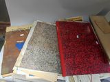 a lot of papers on a table next to a chair
