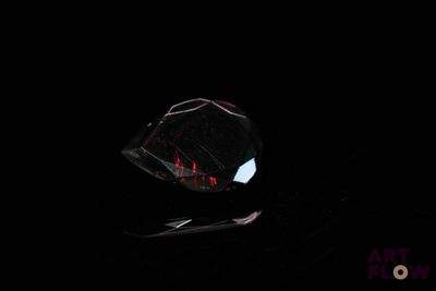 a crystal ball sitting on a table in the dark