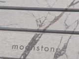 a close up of a bench with a sign on it