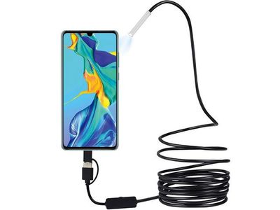a close up of a cell phone connected to a charging cable