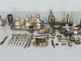a lot of silver items that are on a table