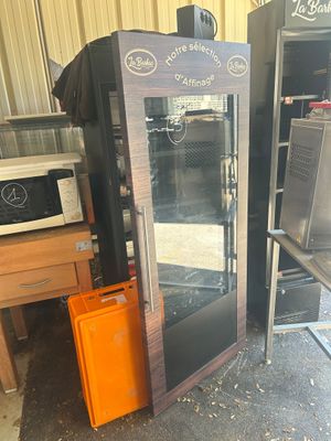 a refrigerator that is sitting next to other appliances