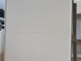 an image of a white refrigerator in a room