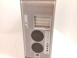 a computer on a white table with a white background