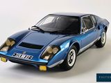 a blue model of a sports car on a white background