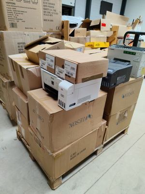 many boxes of electronic equipment stacked on top of each other