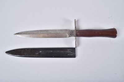 two knives that are sitting on a white surface