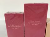 a couple of boxes of perfume sitting on top of a table