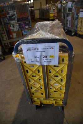 a cart that has a sign on it in a store