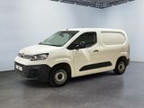 the white van is parked in the empty room of the building