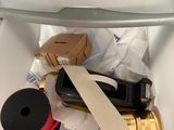 a picture of a trash can with various items inside of it