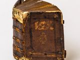 an old book that is sitting on top of a table