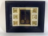 a picture of a clock in a picture frame on a wall