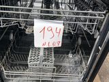 a dishwasher that has a lot of dishes in it