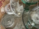 many empty wine glasses sitting on a table