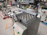 an image of a machine that is working on a piece of metal