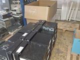many boxes of electronic equipment in a large warehouse