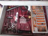 a tool box with tools in it on a table