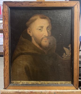 un vieux tableau représentant un homme barbu, dans un cadre en bois