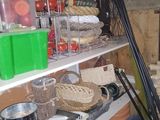 a shelf full of food and other items in a room