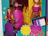 a toy that is in a box with a doll on it