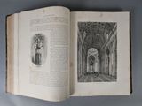 an open book with a picture of a man standing in a building
